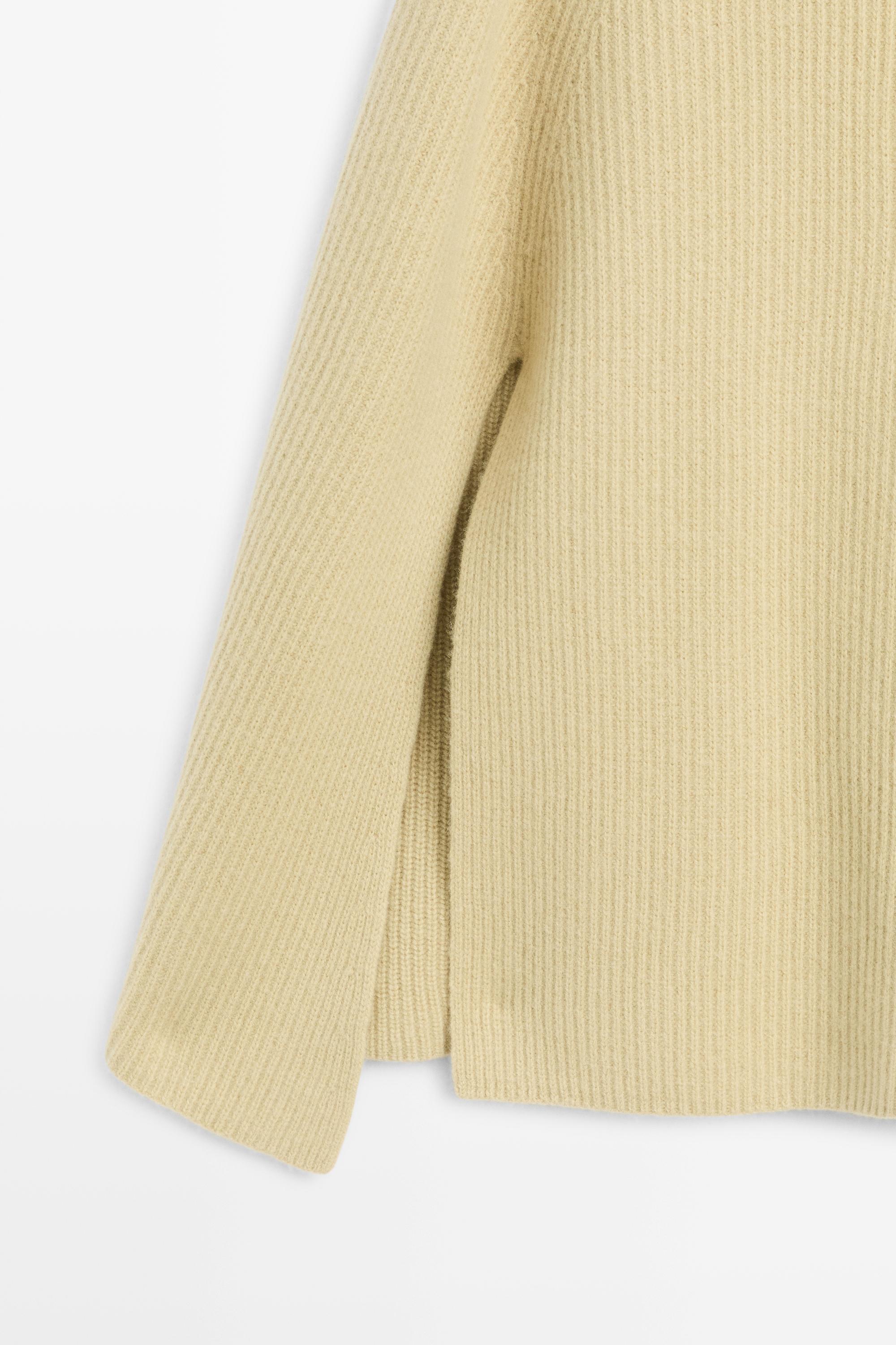 100% wool knit cape with button detail