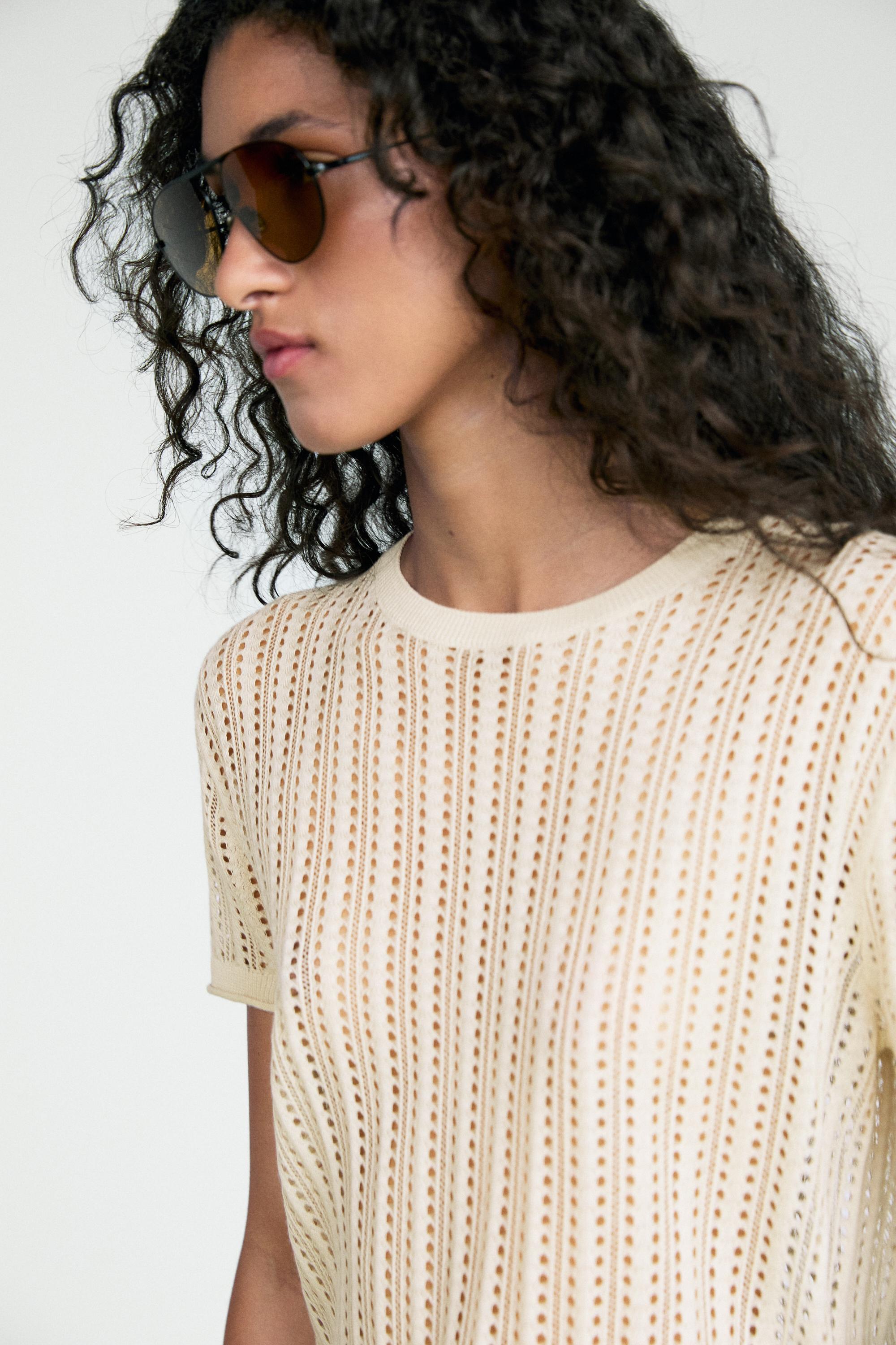 Short sleeve cutwork knit top