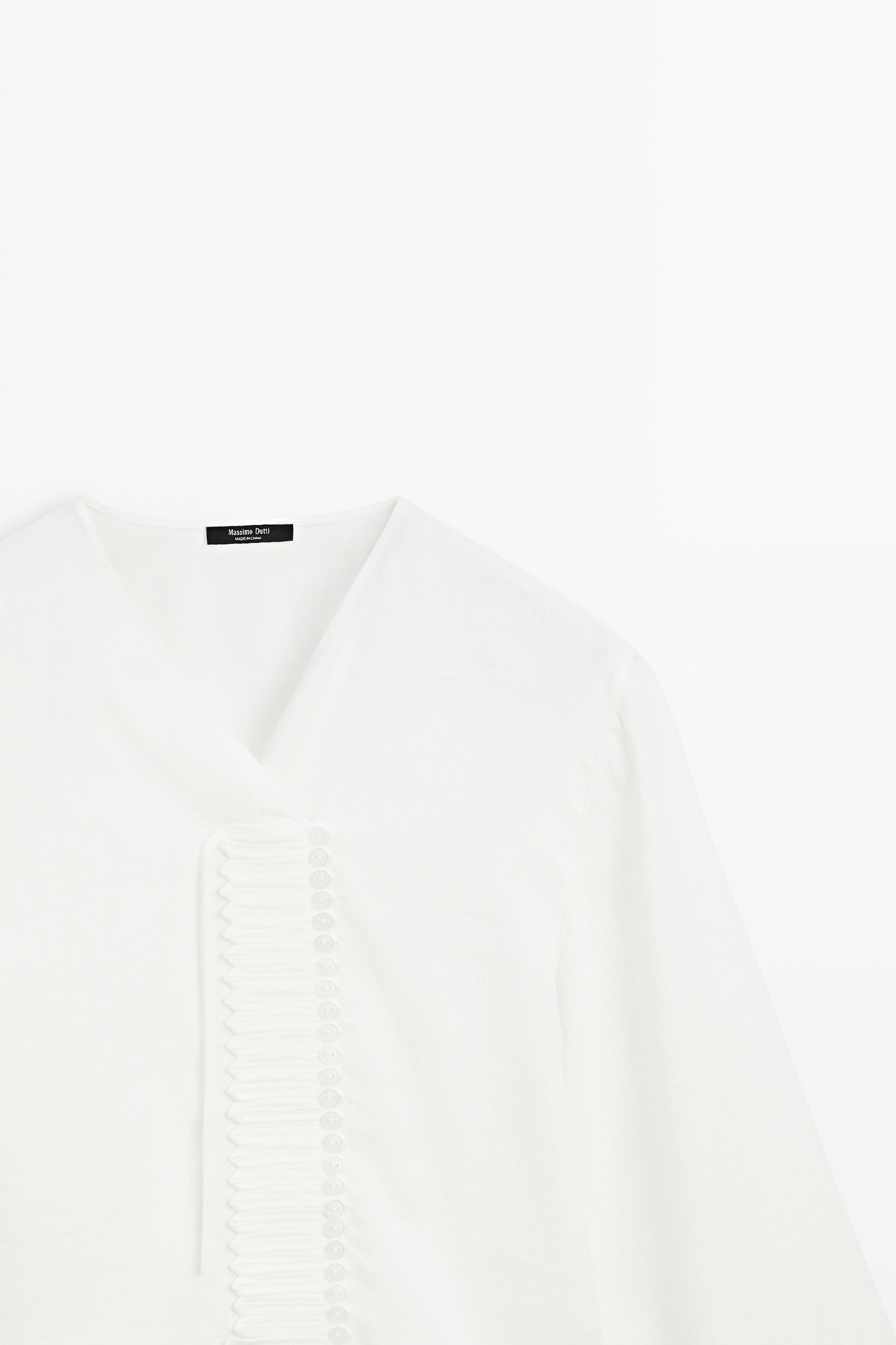 Flowing linen blend blouse with button detail