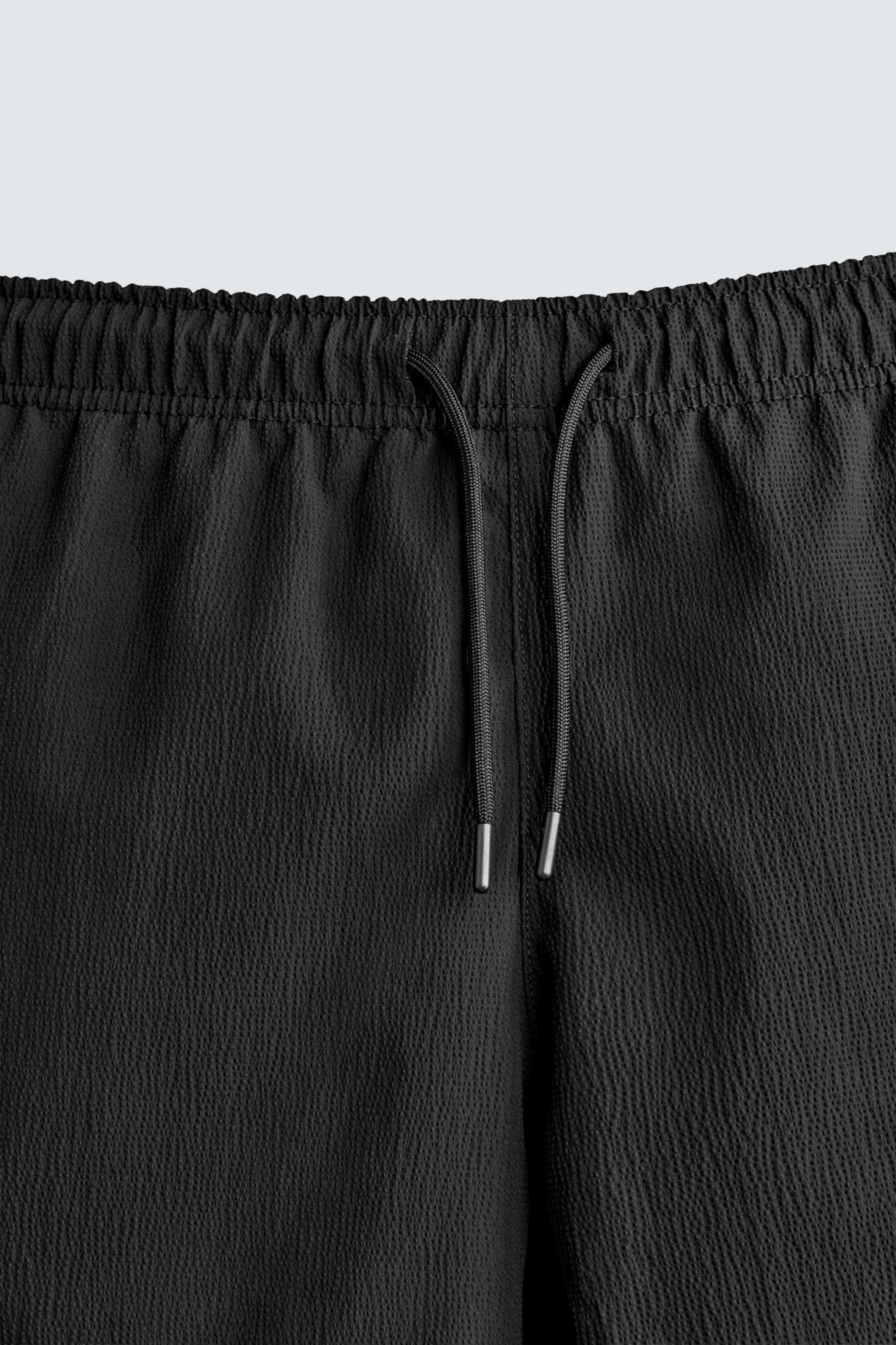 TEXTURED MID-LENGTH SWIMSUIT