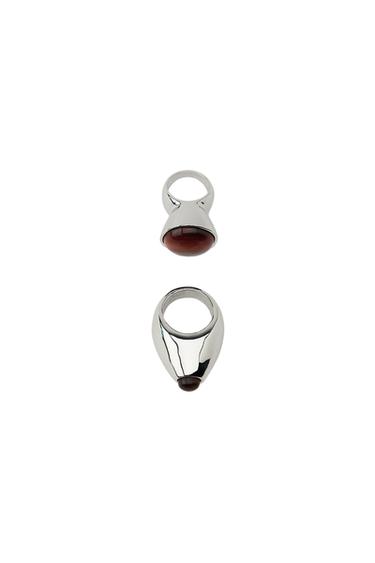 Pack of two silver rings with dark-toned inlaid stone.