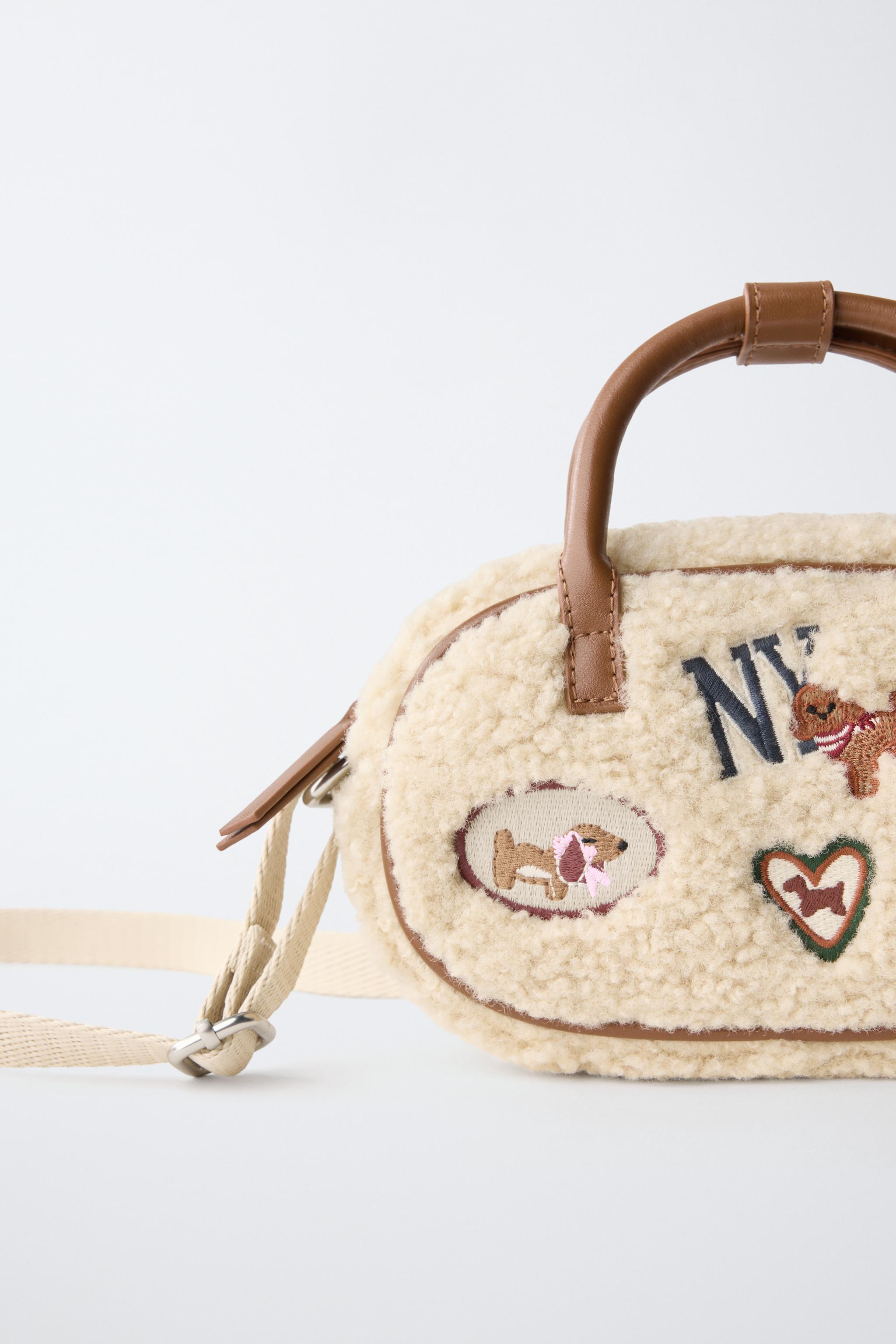 SAC BANDOULIÈRE EN MOUTON RETOURNÉ AVEC PIÈCE