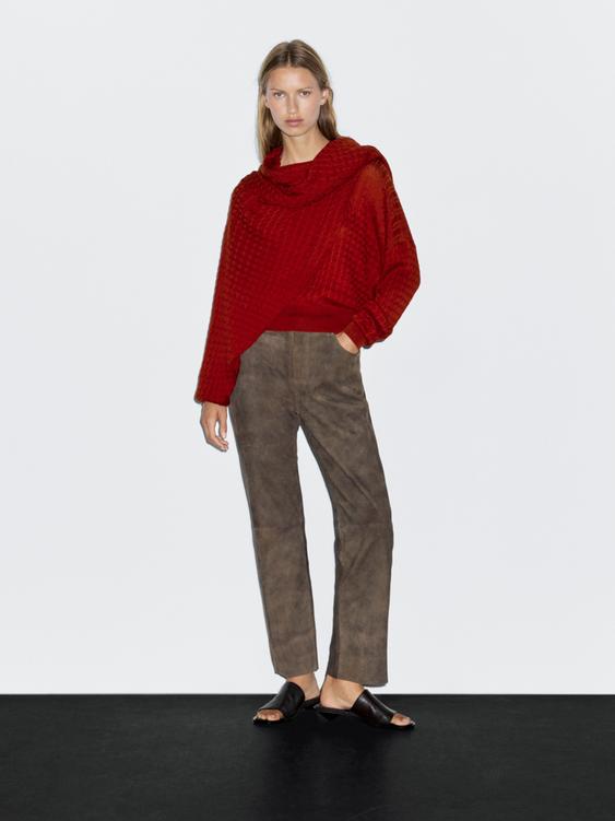 Cable-knit sweater with scarf detail