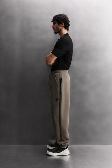 PANTALÓN TÉCNICO ZIPPER - Arena de Zara