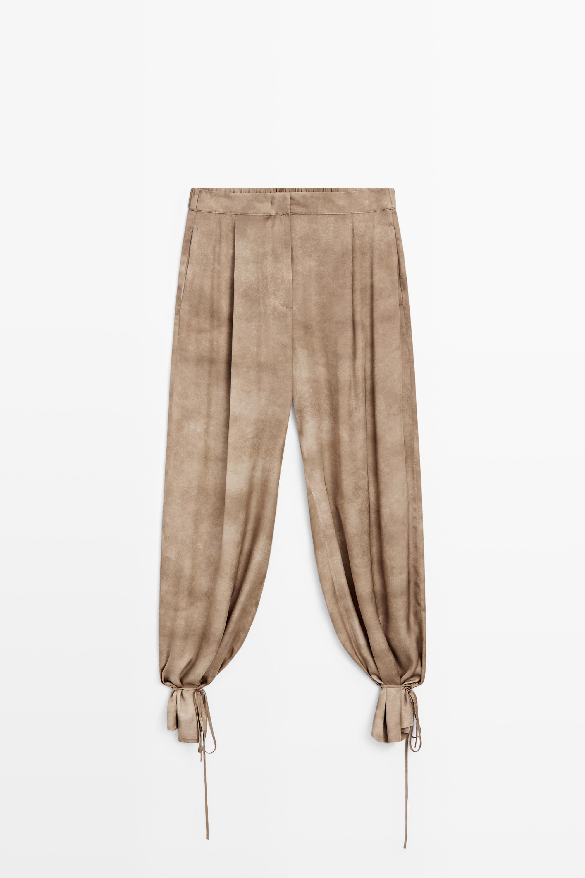 Flowing pants with tie-detail hem