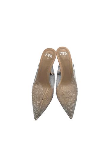 Transparent high heels with pointed toe and sparkly details. Beige insole with visible "ZARA 37" logo.