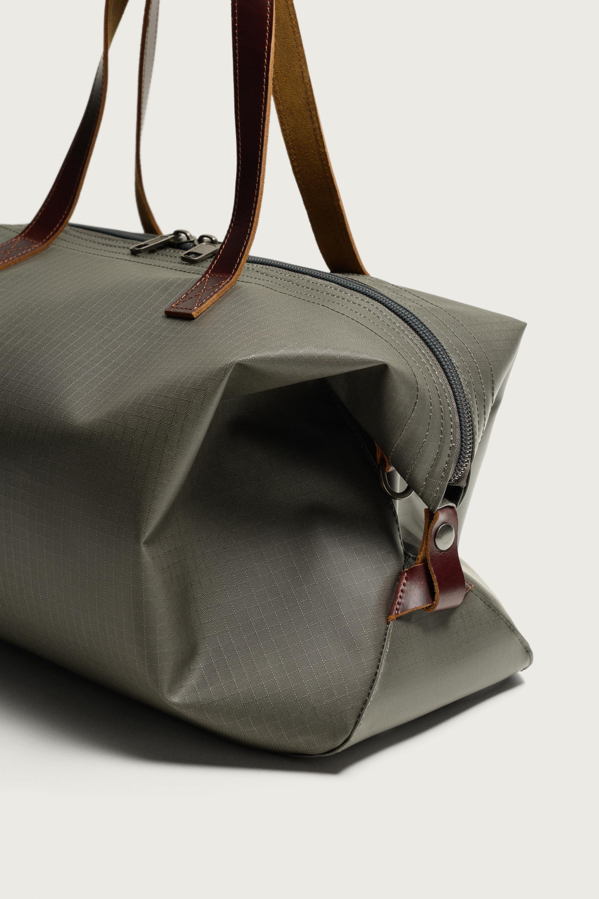 LEATHER-DETAIL TRAVEL BAG