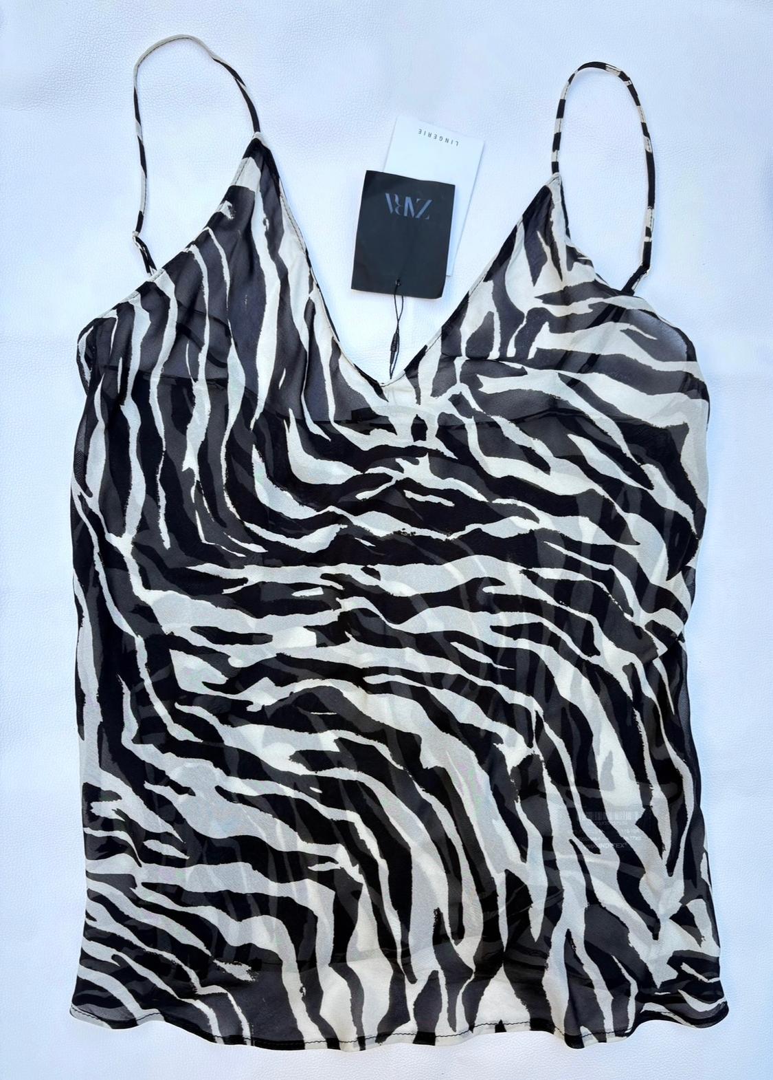 Semi-sheer camisole top with a black and white zebra print on a light background. ZARA and LINGERIE text labels.