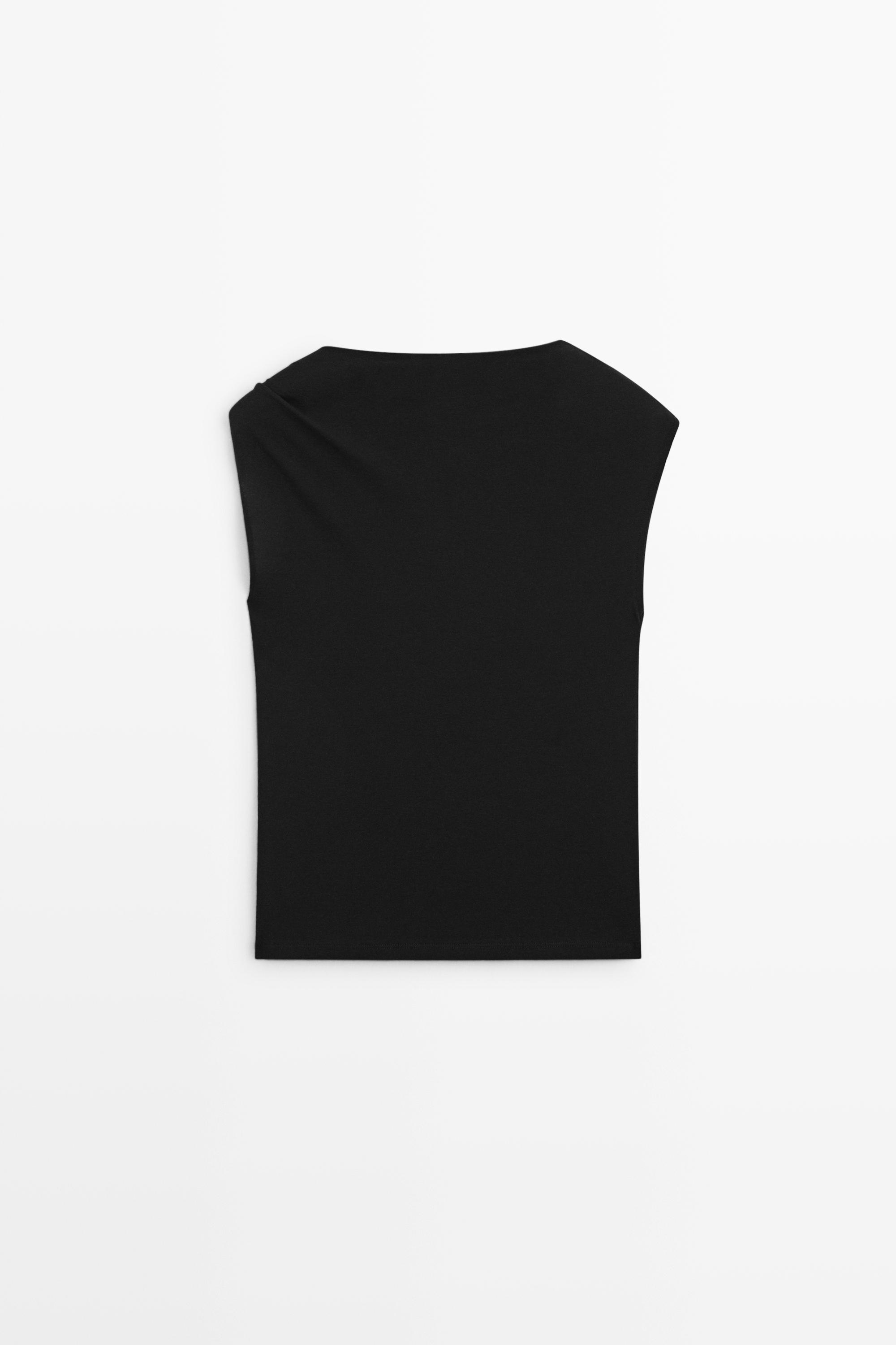 Asymmetric metal detail top