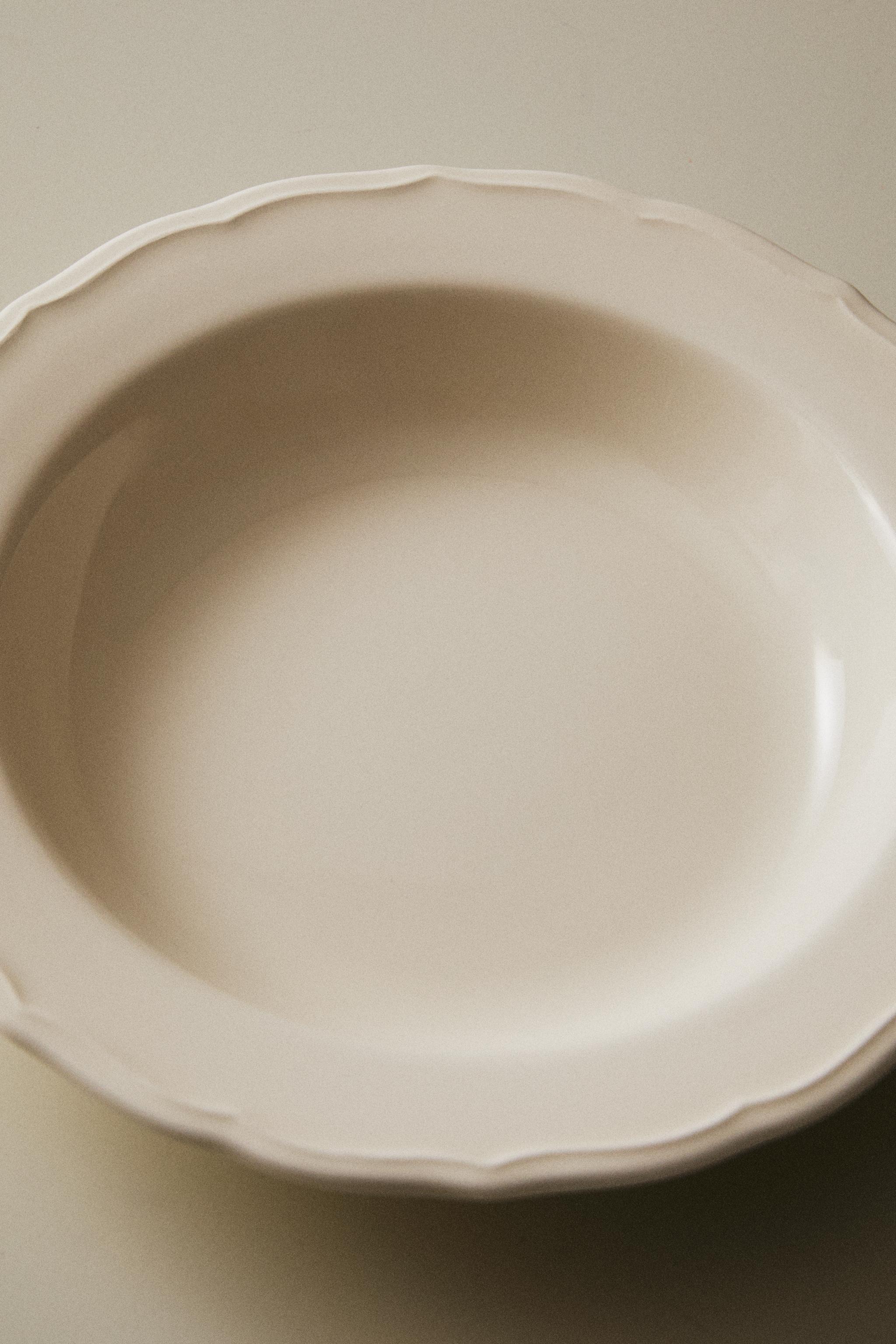 EARTHENWARE SOUP PLATE WITH RAISED-DESIGN EDGE