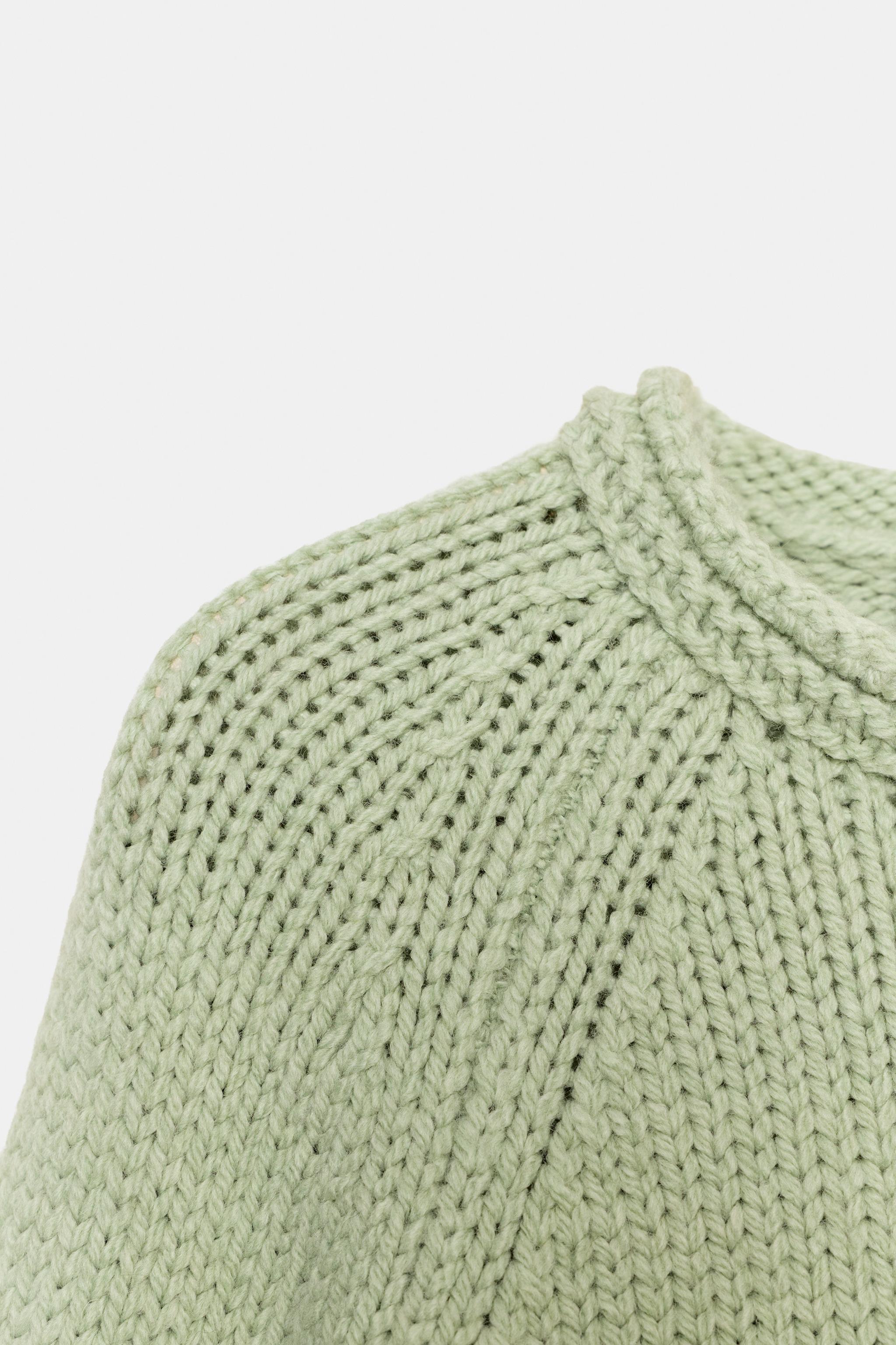 PULL EN MAILLE À BAS ASYMÉTRIQUE