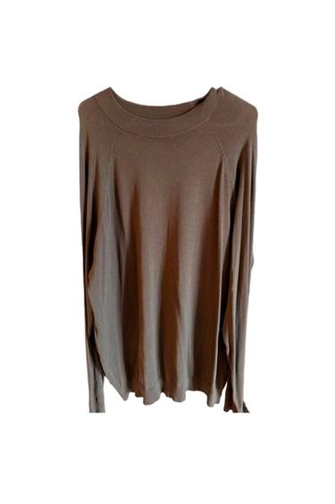 Brown long-sleeved crewneck sweater, soft knit with a loose fit, on a white background.
