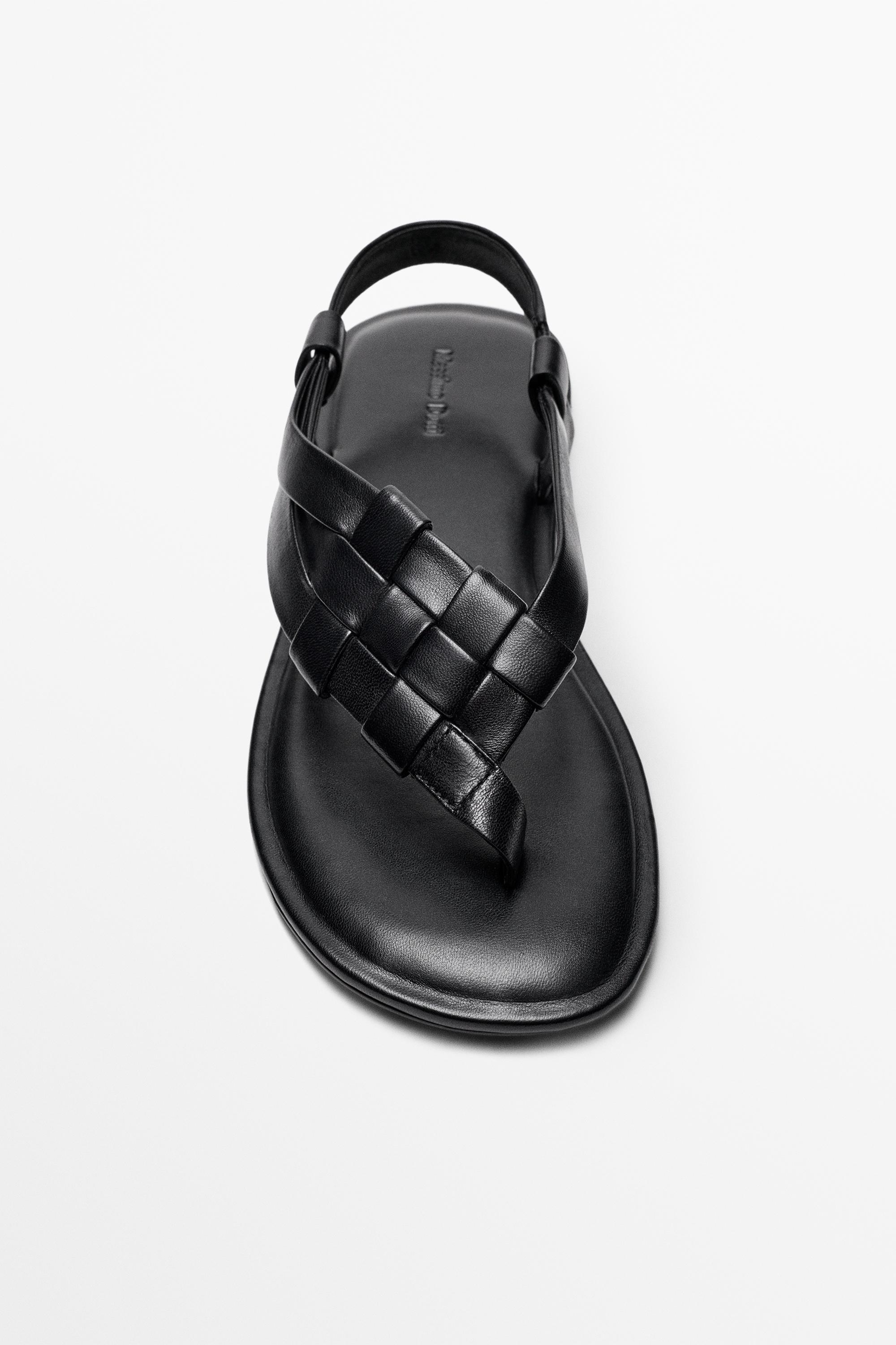 Sandale plate en cuir tressé
