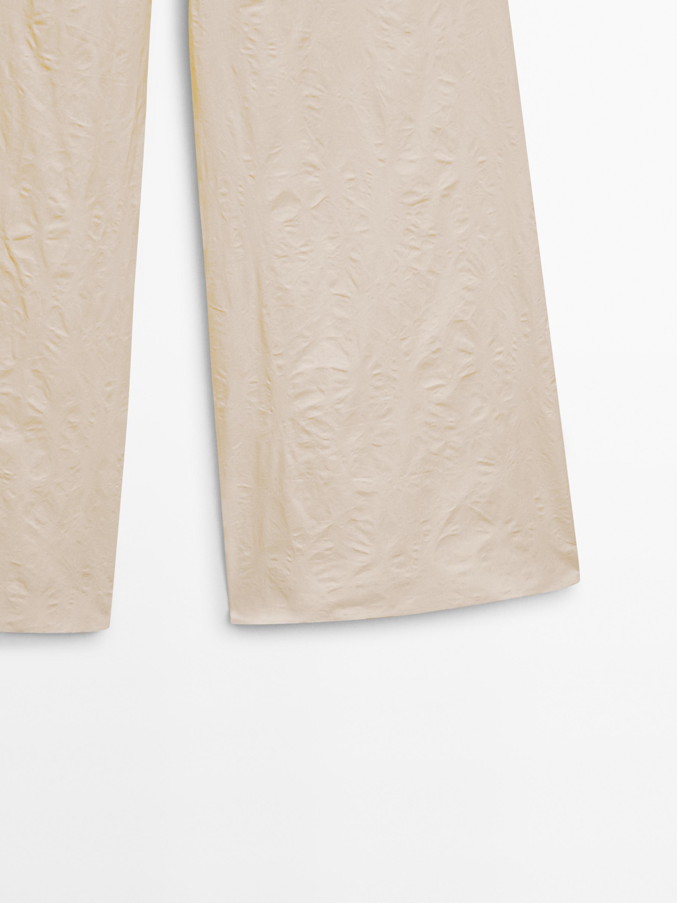 Creased-effect palazzo trousers - Limited Edition - Light beige