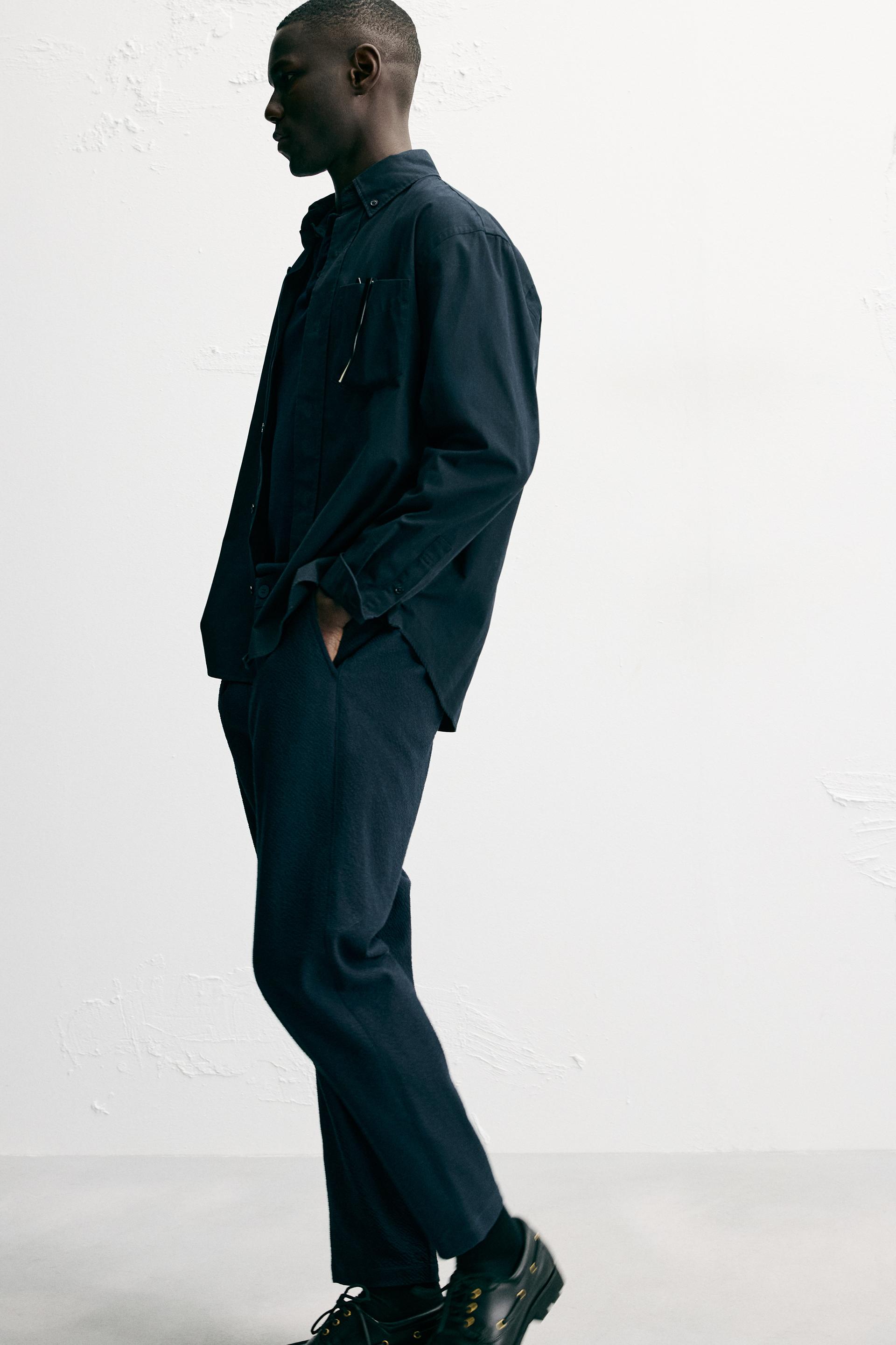 TEXTURED PLEATED PANTS