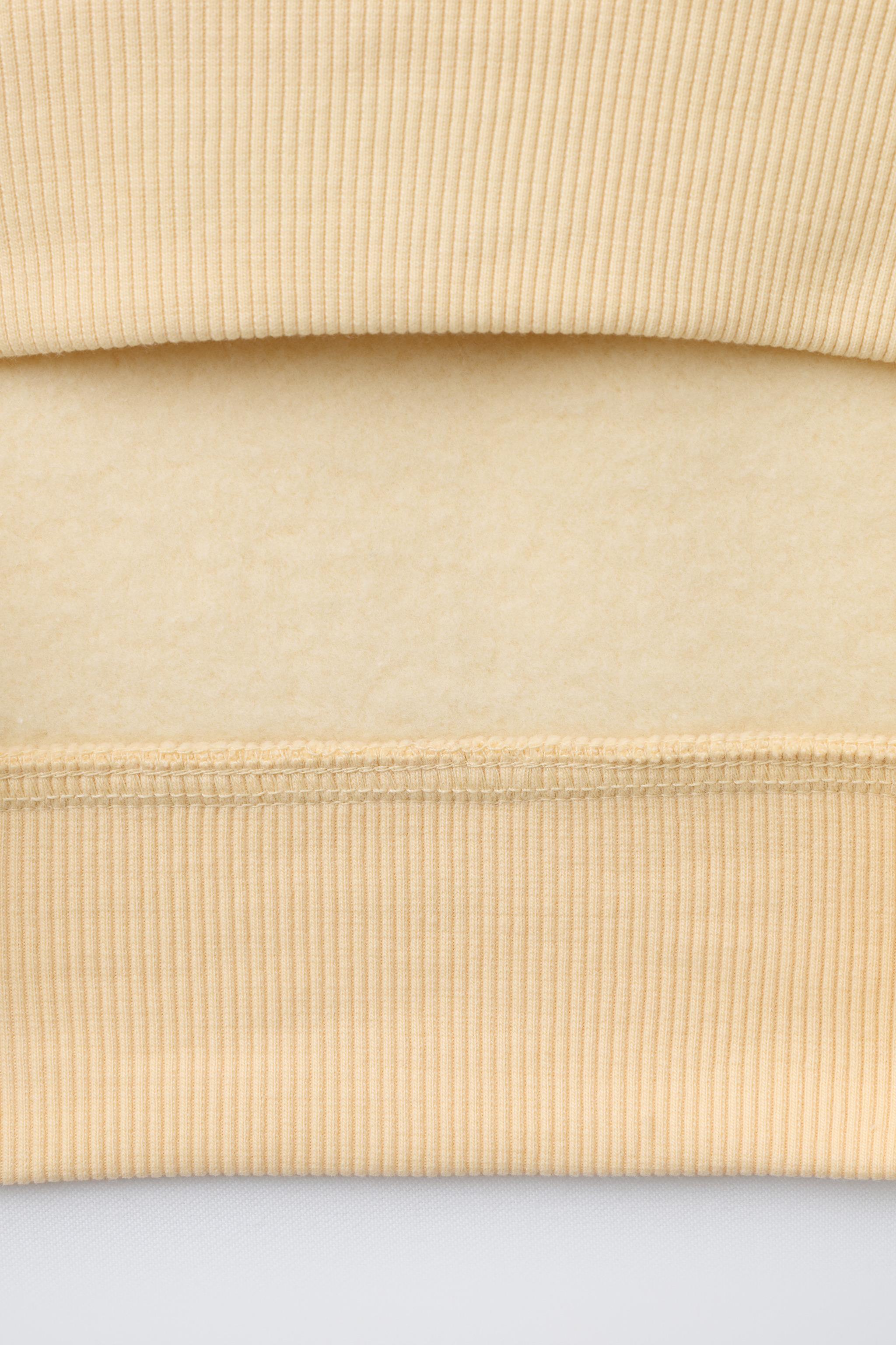 SWEAT AVEC PIÈCE EN VELOURS BOUCLÉ