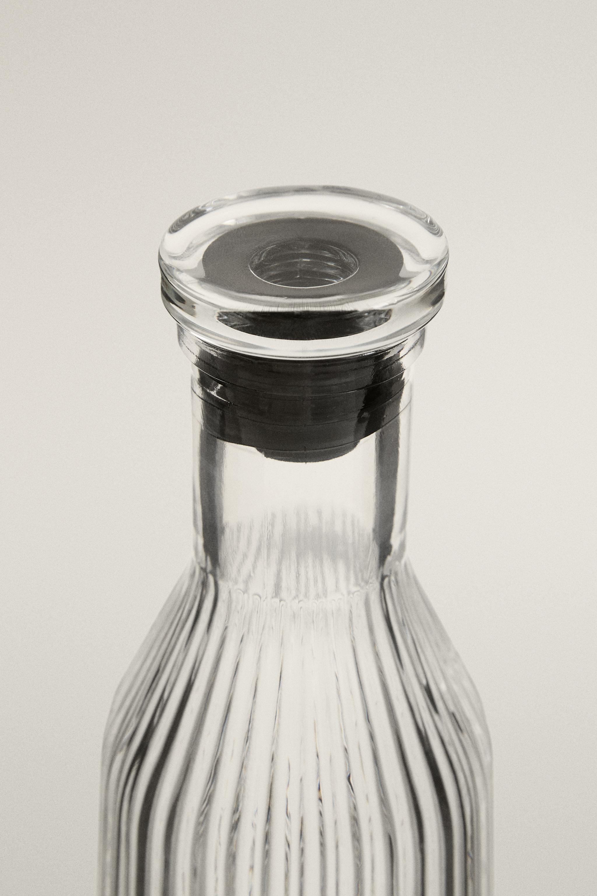 RAISED DESIGN GLASS BOTTLE