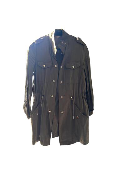 Front view of a long green jacket with front pockets and metal buttons.