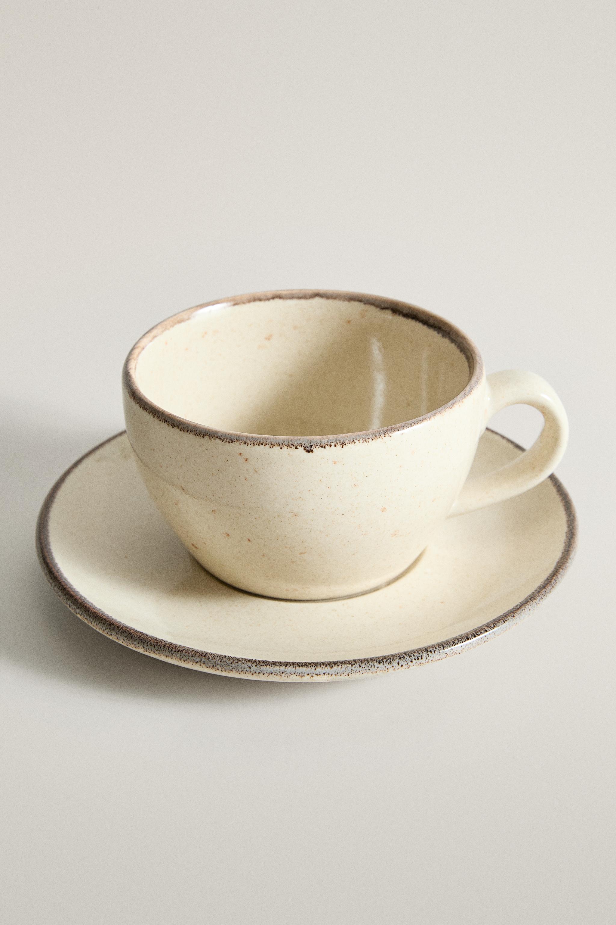 STONEWARE TEACUP AND SAUCER