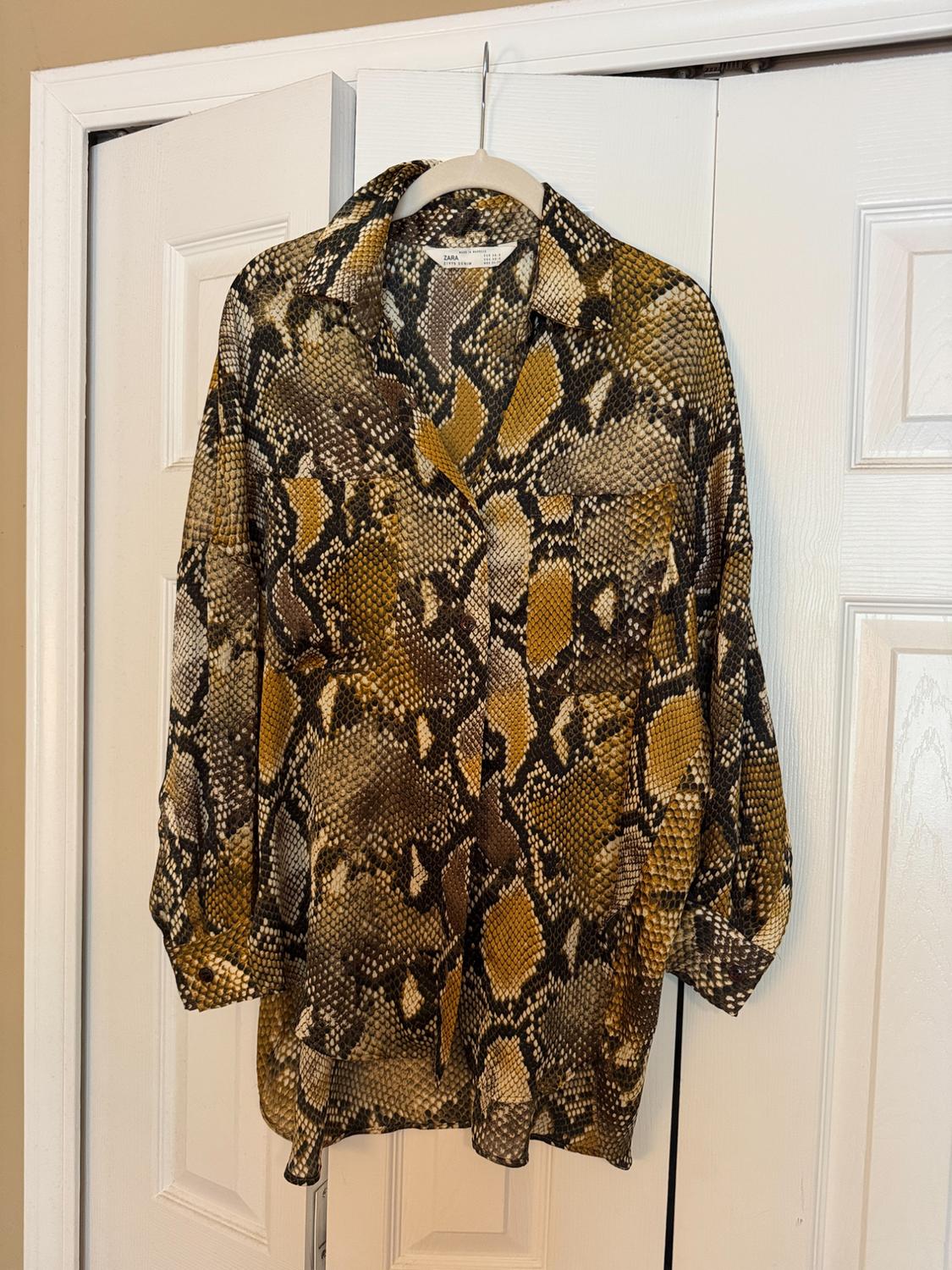 Front view of a shirt with a brown and yellow snake print, featuring a classic collar and buttons.