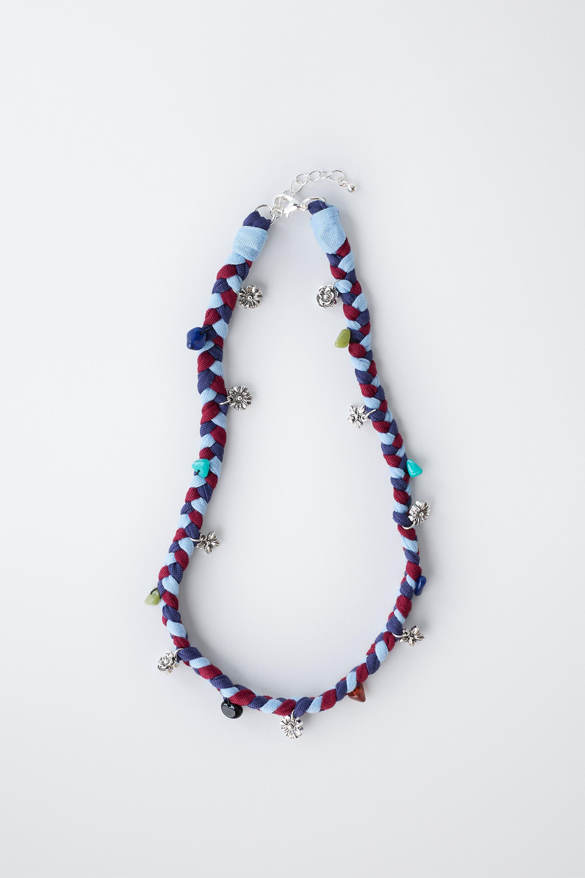 BRAIDED NECKLACE WITH FLOWER PENDANTS