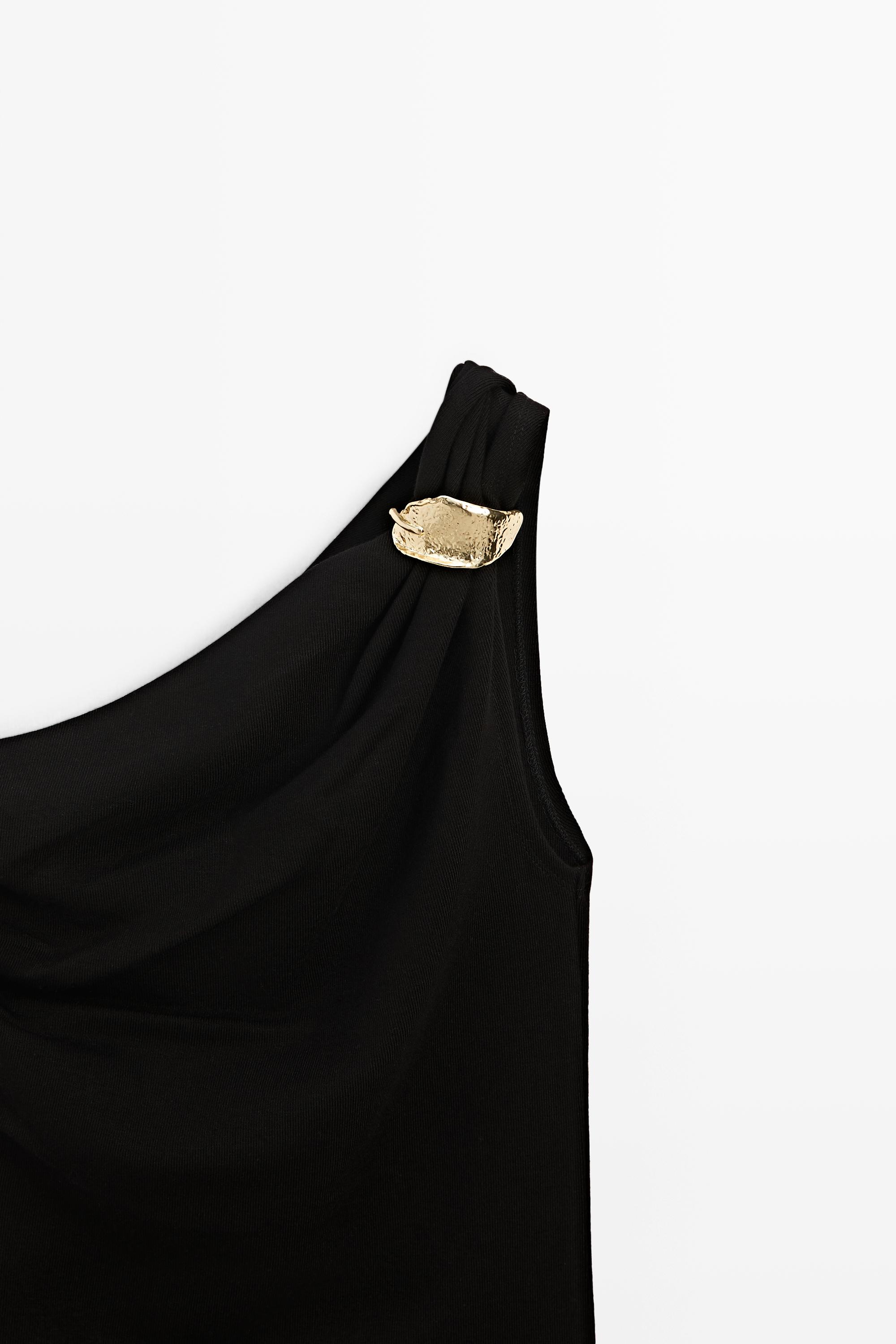 Asymmetric top with metal detail