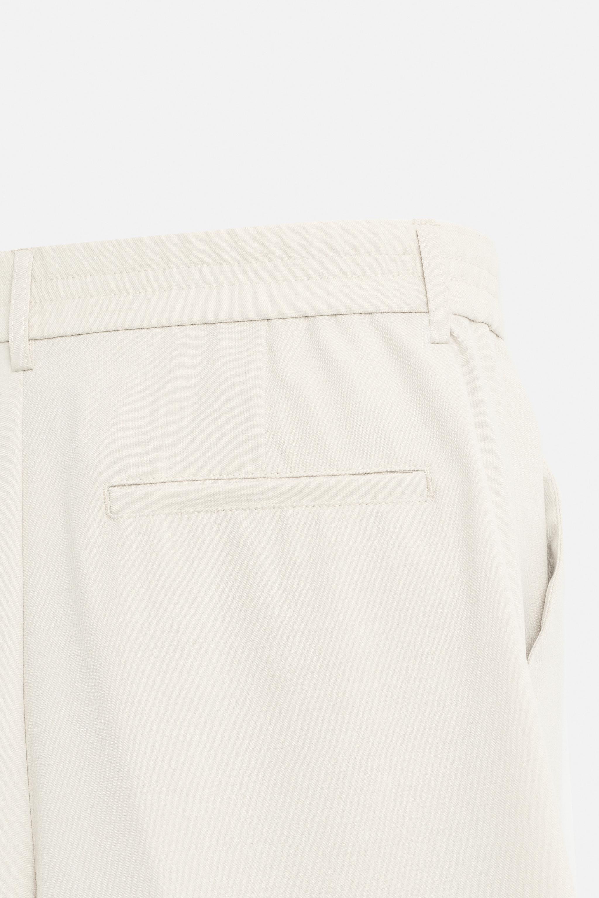 PLEATED WIDE FIT PANTS