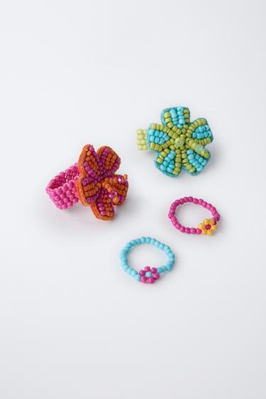 FOUR PACK OF FLOWER BEADED RINGS - Fuchsia by Zara - Image 1