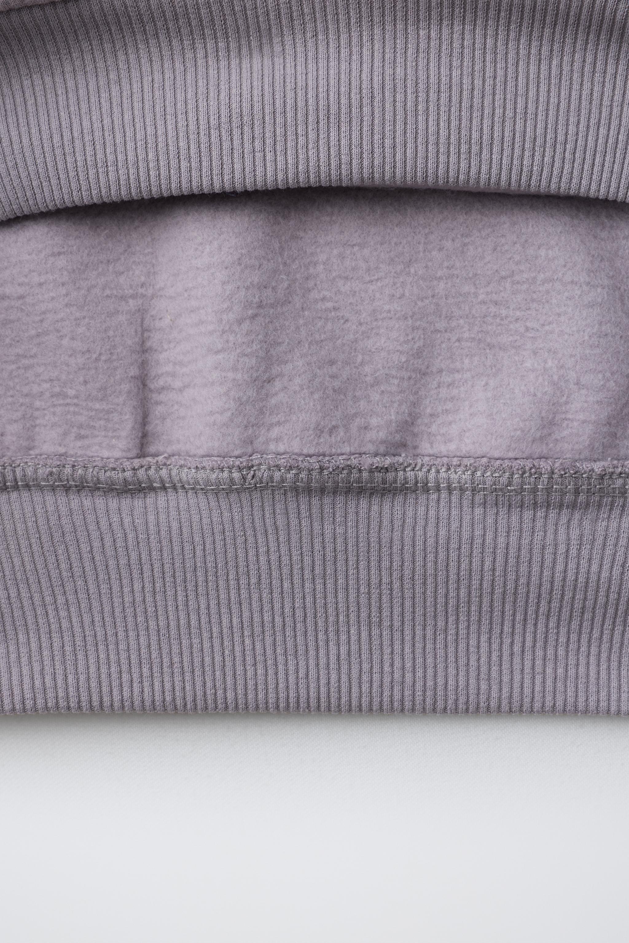 SWEAT À CAPUCHE CLOUS ÉTOILES