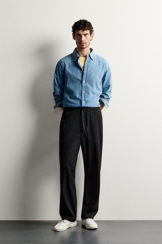 PANTALÓN REGULAR FIT CONFORT - Negro de Zara - Imagen 0