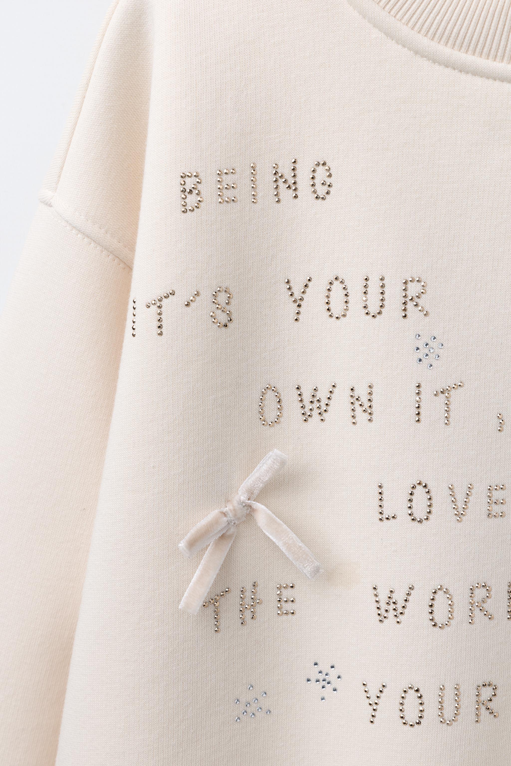 RHINESTONE TEXT SWEATSHIRT