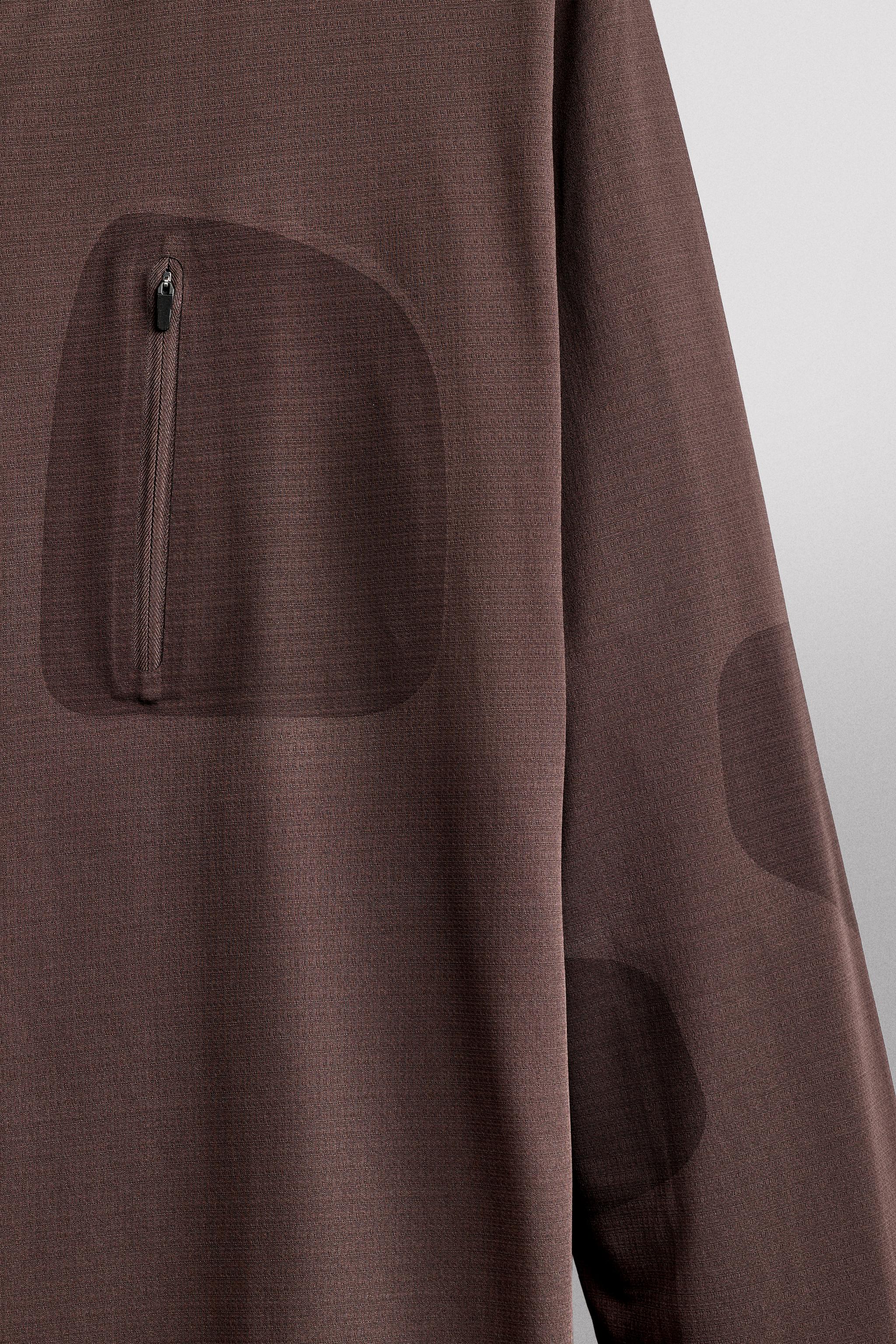 T-SHIRT TECHNIQUE À MANCHES LONGUES AVEC POCHE