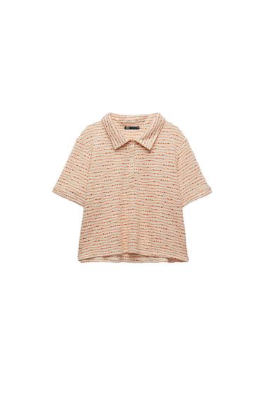 Front view of an orange and white striped shirt with a classic collar and short sleeves.