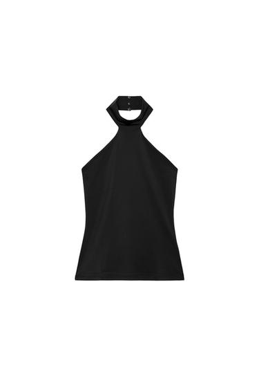 Front view of a sleeveless black top with a high neck and button fastening.