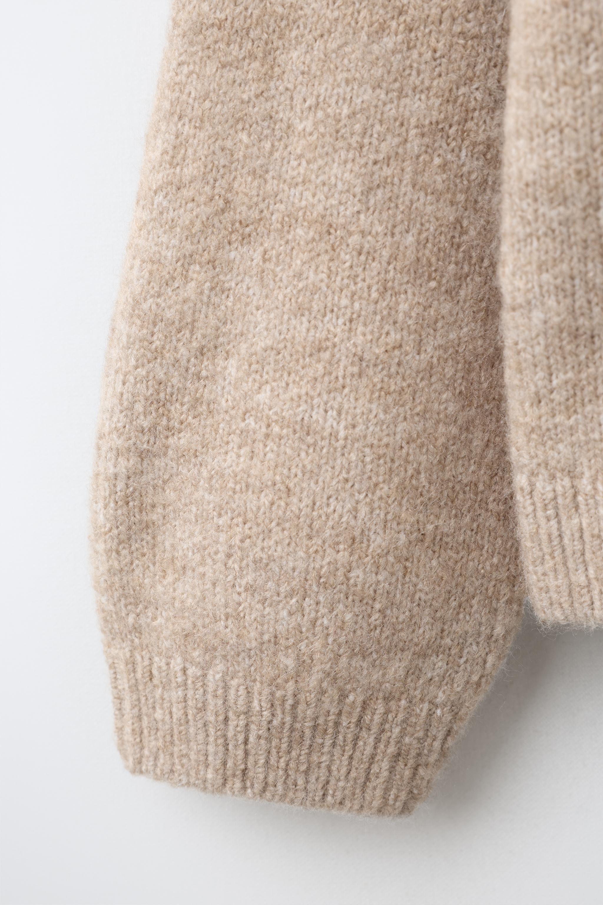PULL EN MAILLE OURSONNE POMPOM