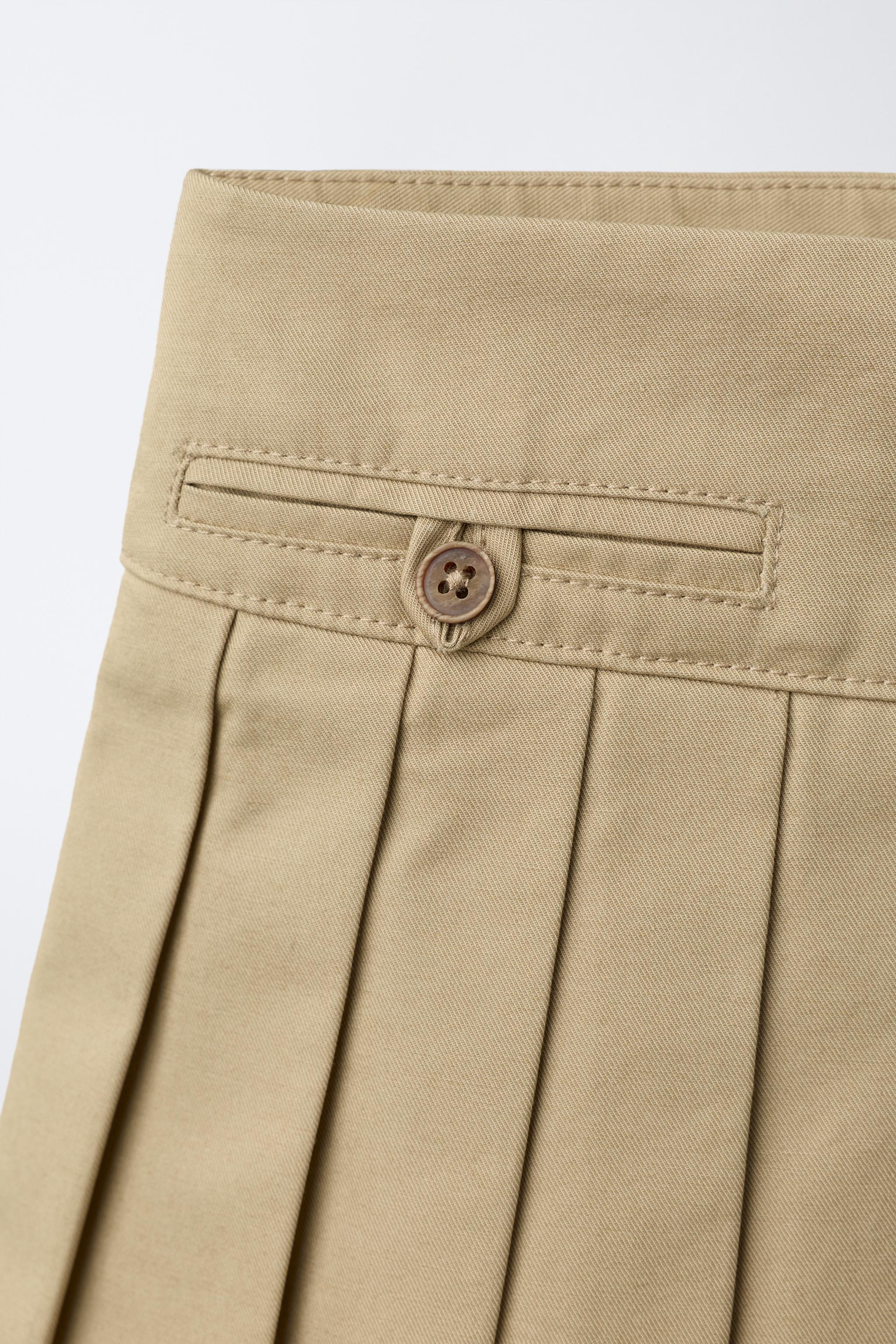 SOLID PLEATED SKIRT