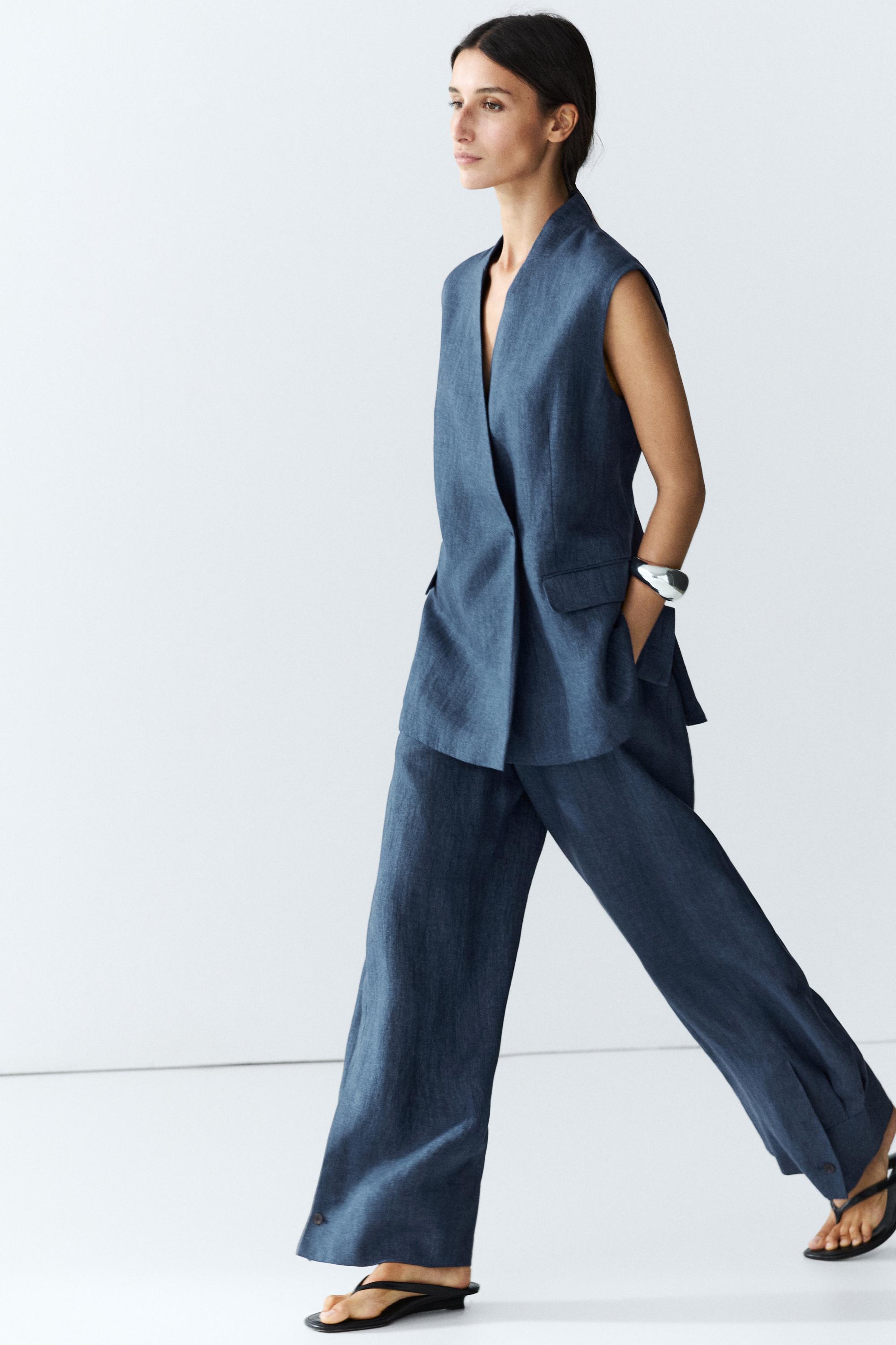 Total look linen pants with buttoned hems