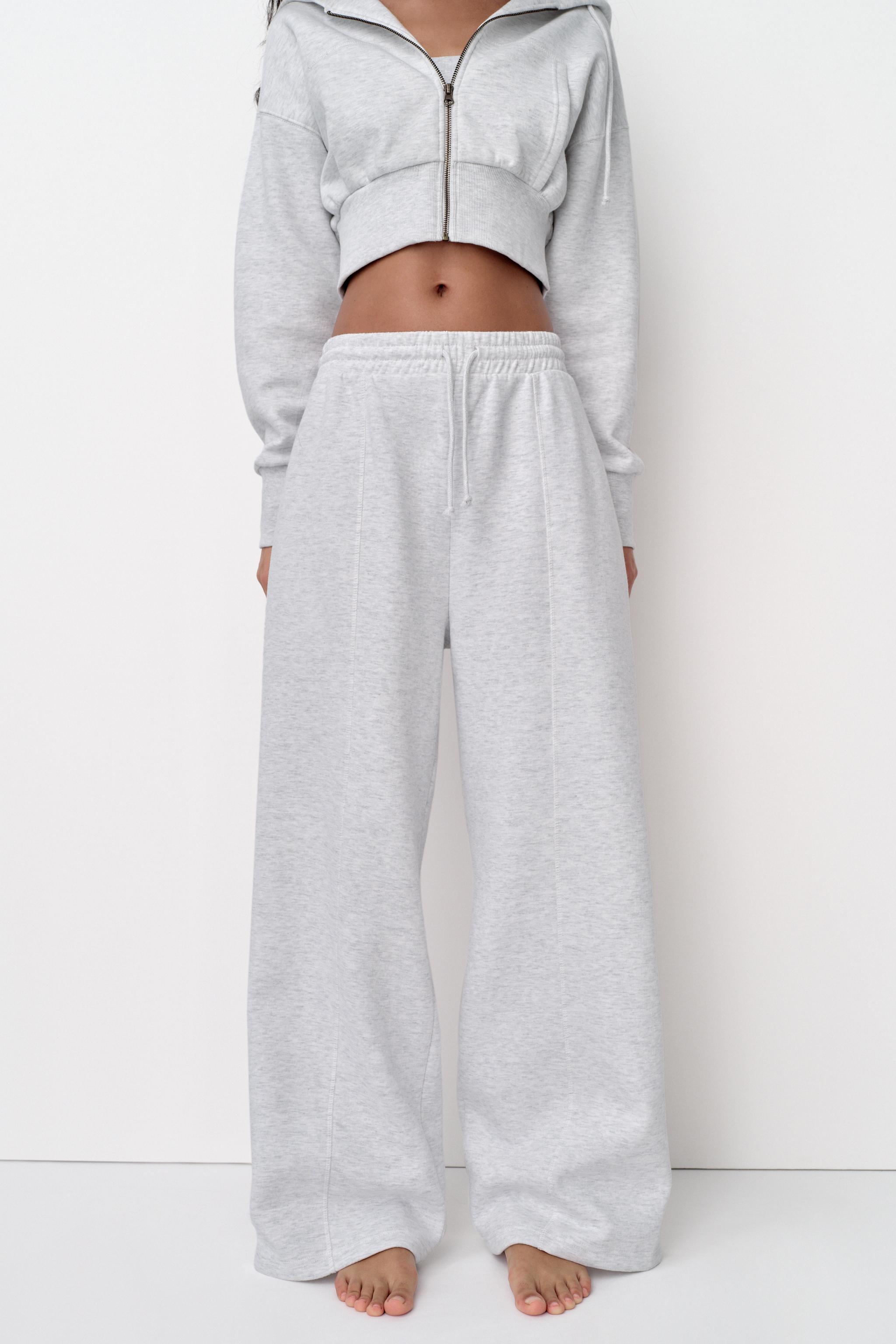 Pants with a high waist with adjustable elastic drawstring waistband.  Straight leg and pronounced seams. - Gray marl