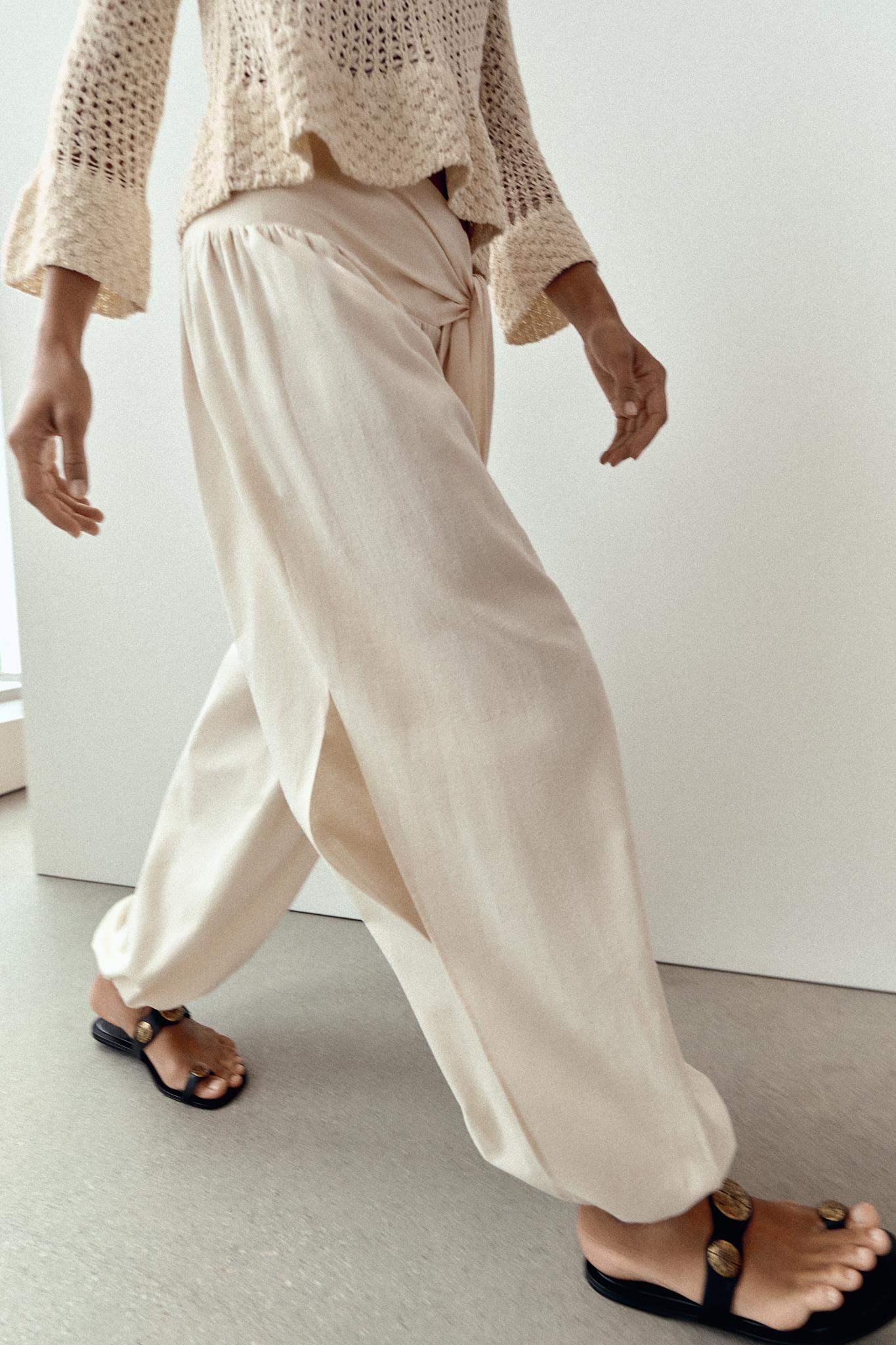 FLAT SANDALS WITH METALLIC DETAILS