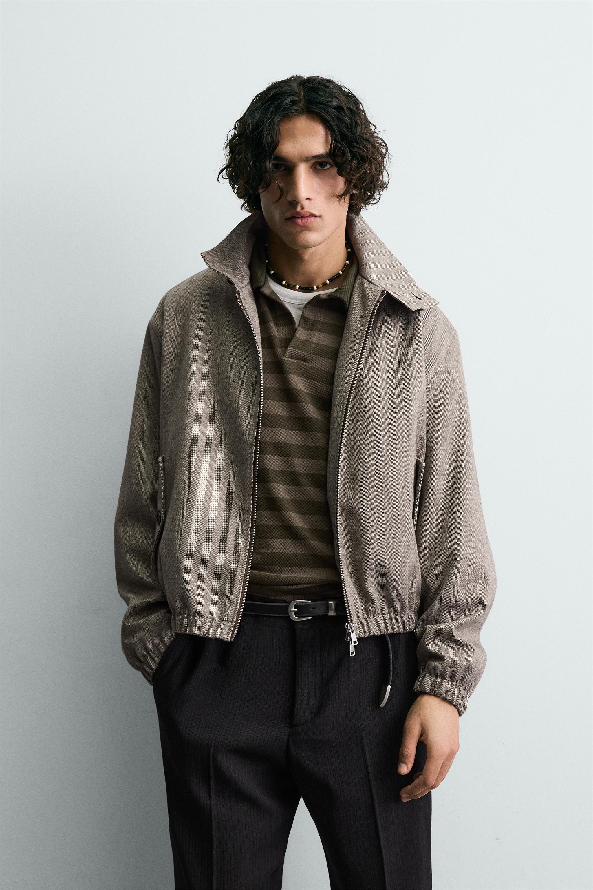 BLOUSON COURT COUPE STRUCTURÉE À CHEVRONS