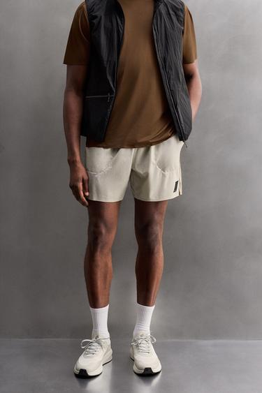 PANTALONS CURTS RUNNING COLOR BLOCK - Blanc trencat de Zara