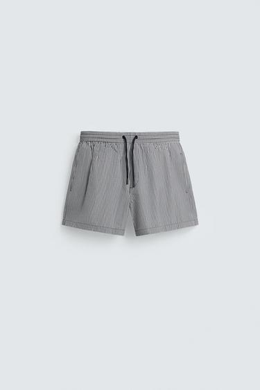ПЛАВКИ СРЕДНЕЙ ДЛИНЫ ИЗ ТКАНИ СЕЕРСАКЕР — МОРСКОЙ СИНИЙ от Zara