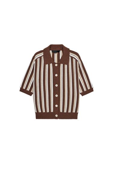 Front view of brown and white striped jacket with buttons and classic collar.