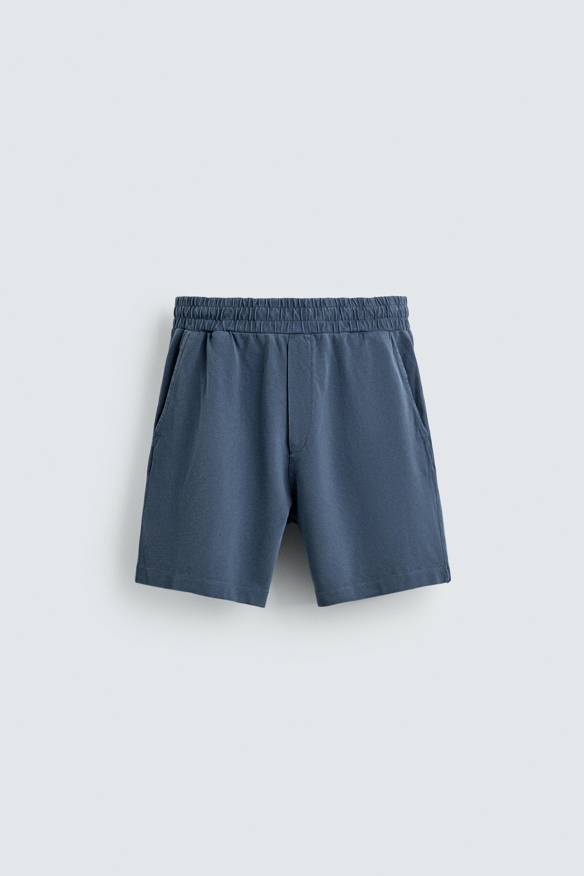 BERMUDA EN PIQUÉ REGULAR FIT DÉLAVÉ