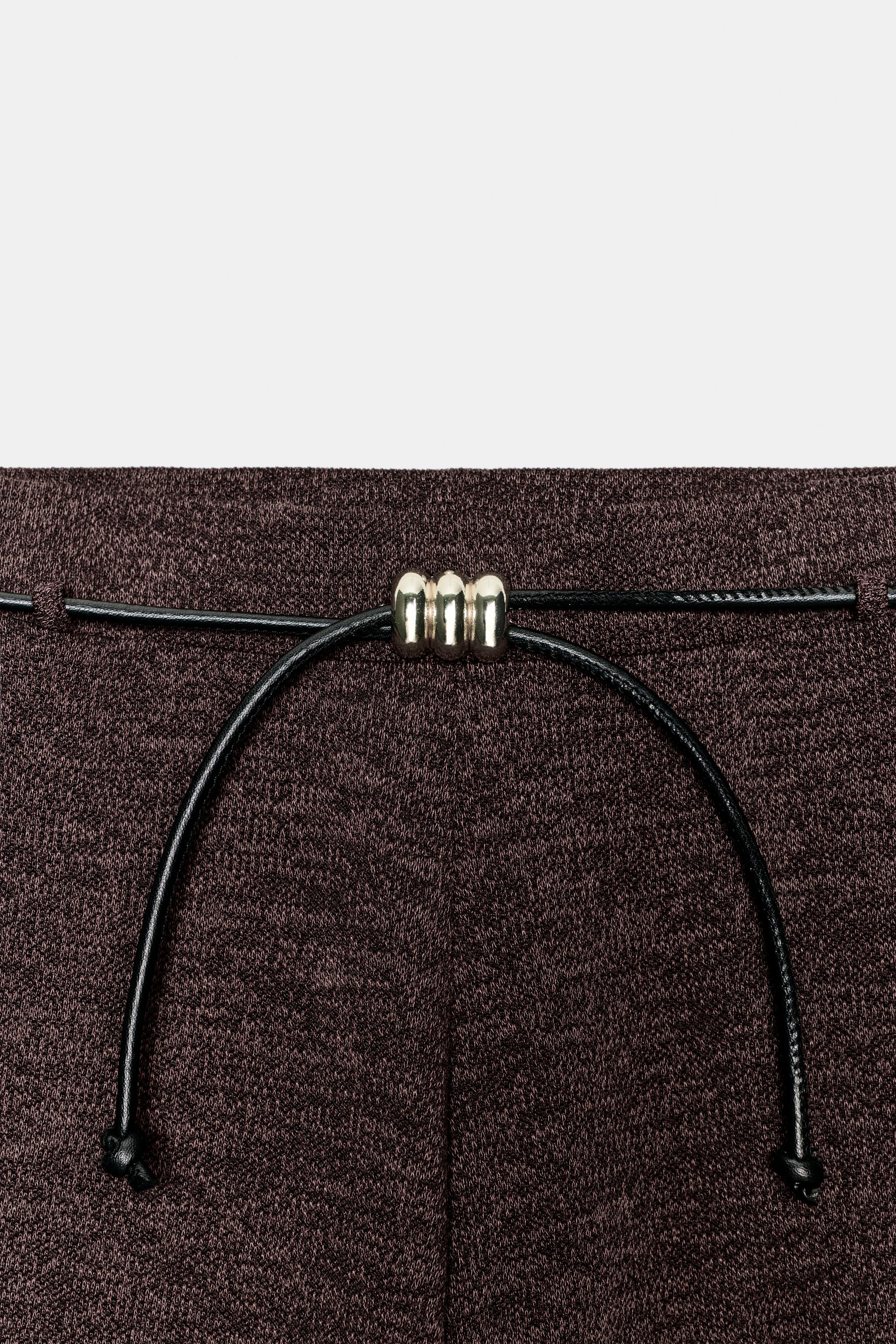 PIQUÉ BELTED PANTS