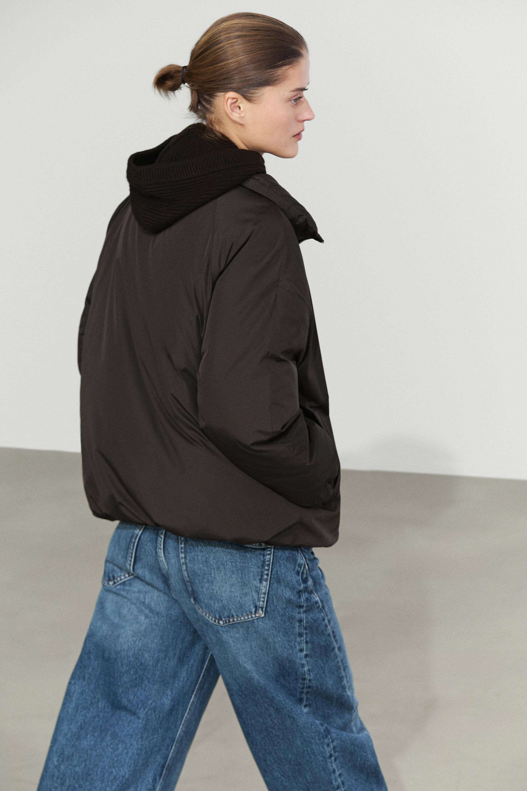 Down jacket with detachable detail piece
