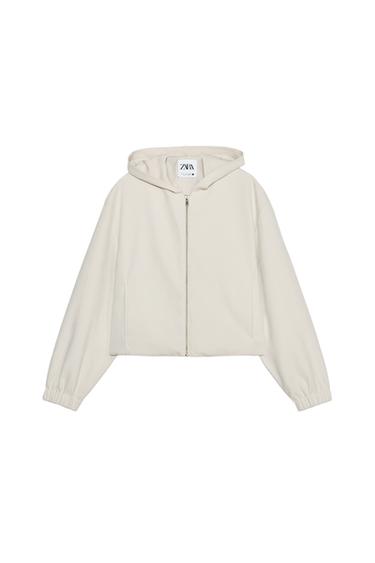 Front view of a beige zip-up hoodie.