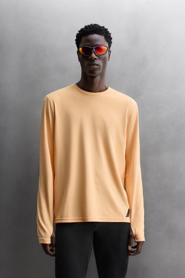 تيشرت جري بأكمام طويلة - البرتقالي الخاص بـ Zara