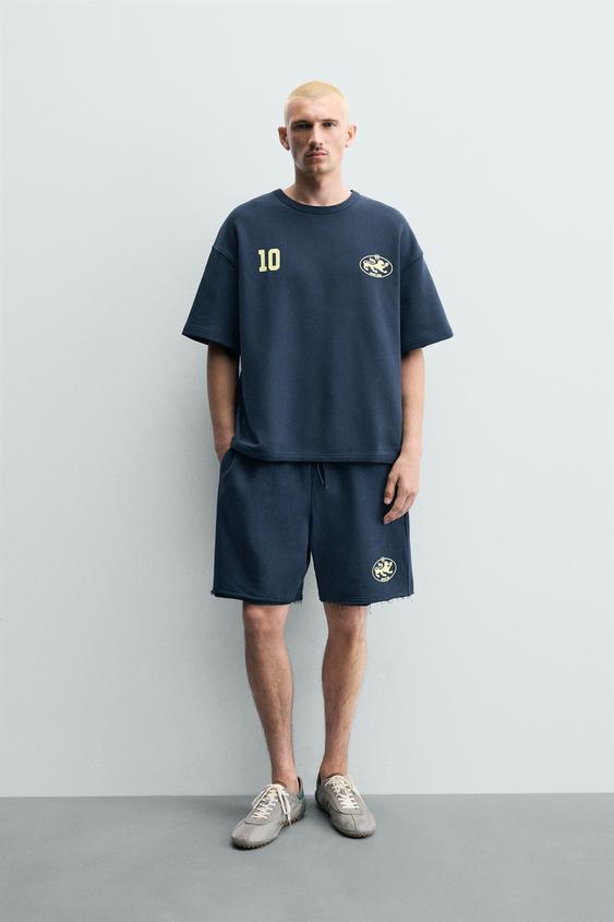 PRINTED GRAPHIC SWEAT SHORTS - Blue de Zara - Imagen 0