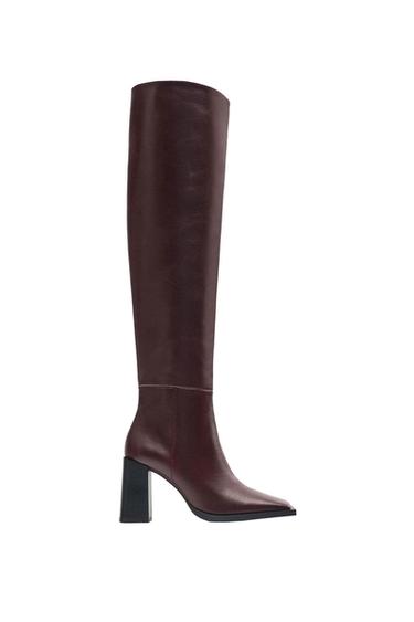 Dark brown leather knee-high boot with black block heel, side view on white background.